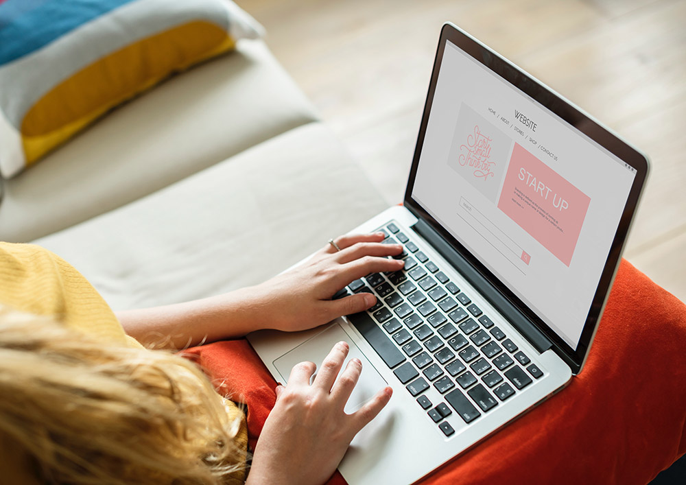 Girl typing with MacBook Air image