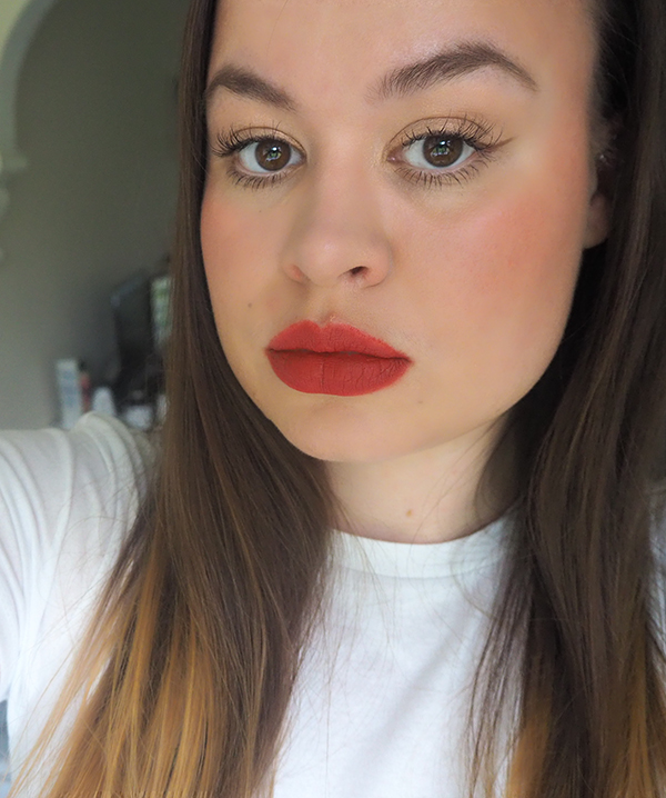 Bold red lip and champagne eyeshadow makeup look image